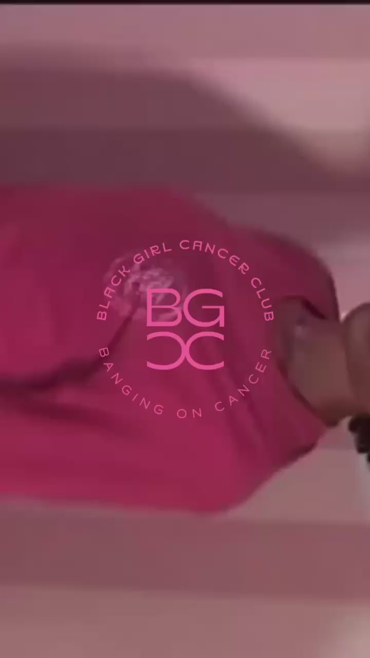 Load video: Video of brand merch photoshoot with two girls taking pictures, laughing and posing